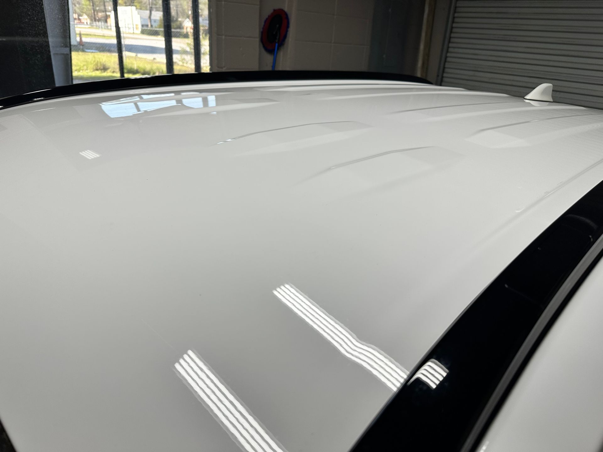 White car roof reflecting light.