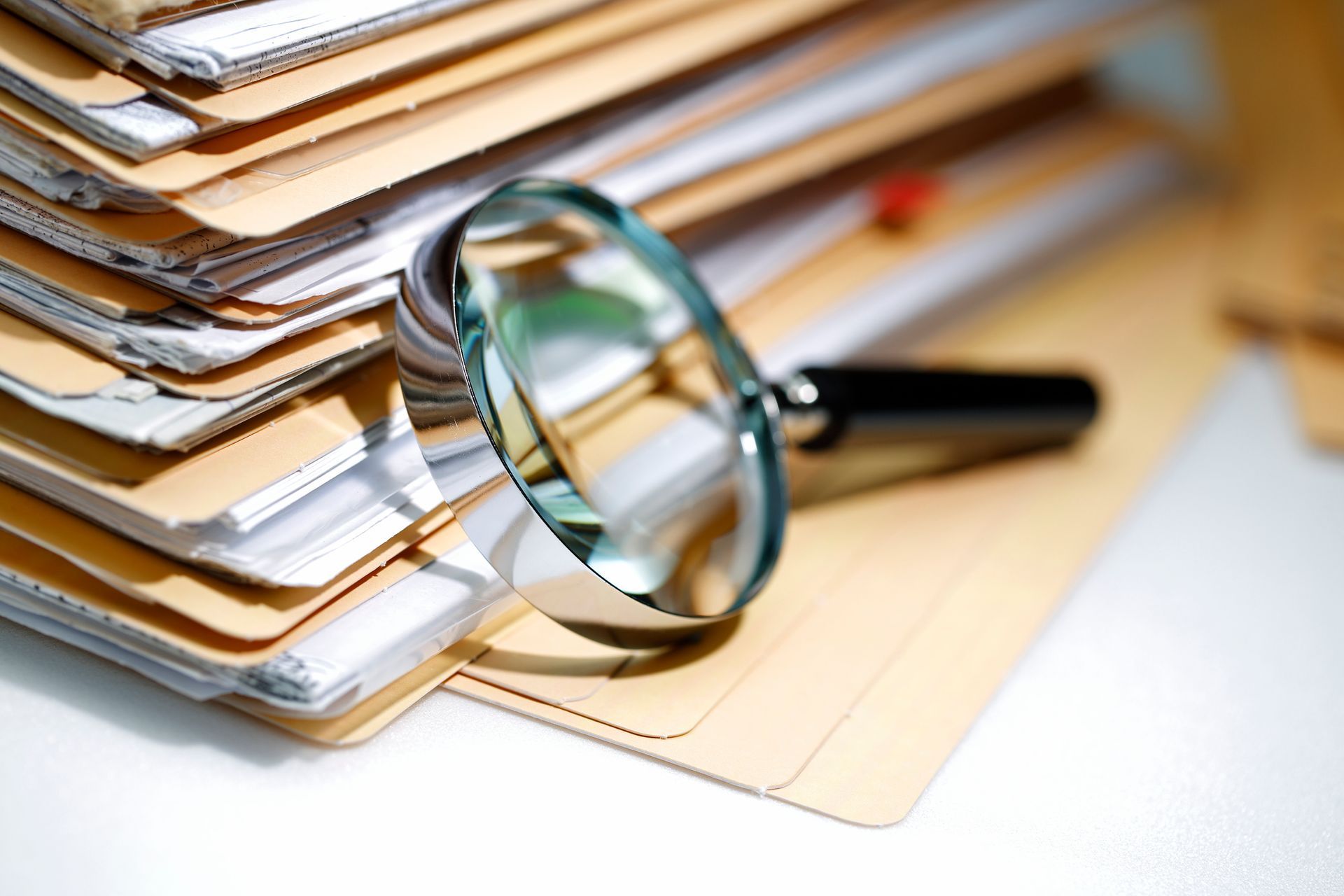A filing cabinet filled with lots of colorful papers.