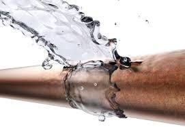 Comfort Air Solution LLC - A man is fixing an air conditioner with a screwdriver.