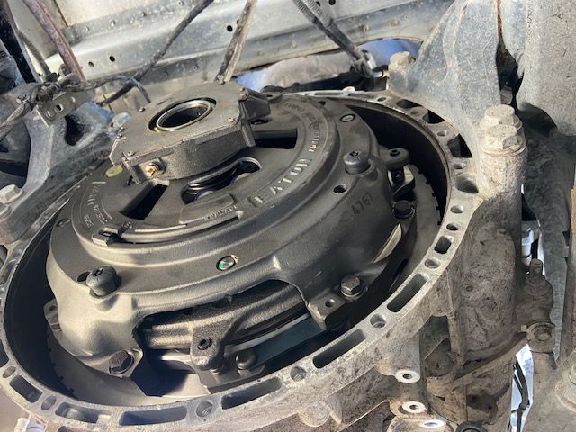 Clutch assembly inside a vehicle transmission housing.