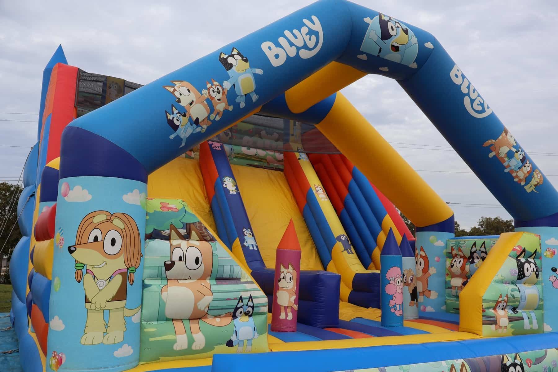 A Large Inflatable Bouncy House With A Slide And A Castle — Bills Amusements In Emerald, QLD