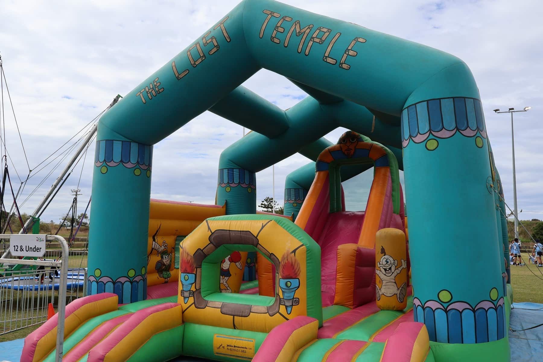 A Bouncy House With The Word Temple On It — Bills Amusements In Gladstone, QLD