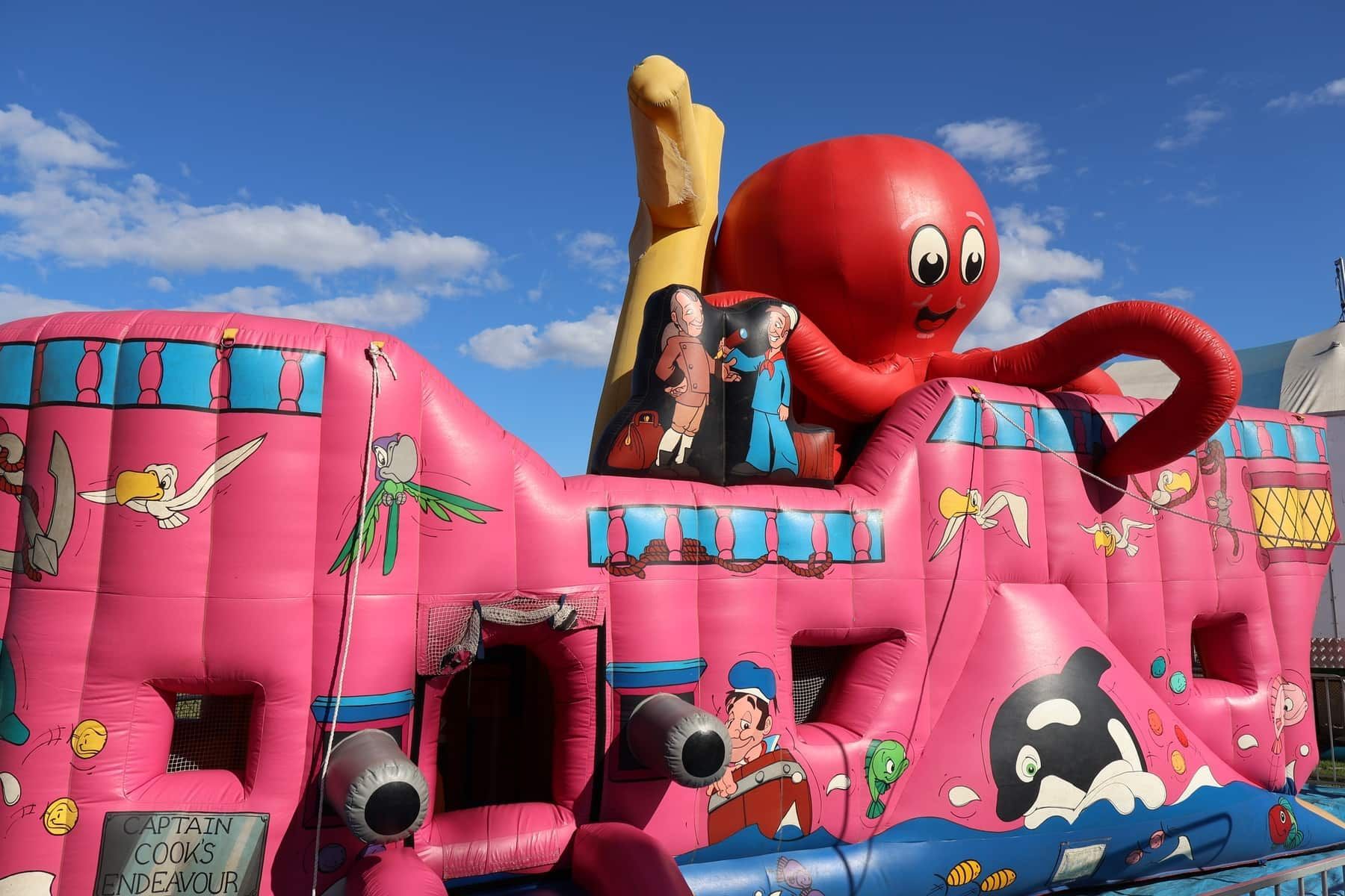 A Pink Bouncy House With An Octopus On Top Of It — Bills Amusements In Biloela, QLD