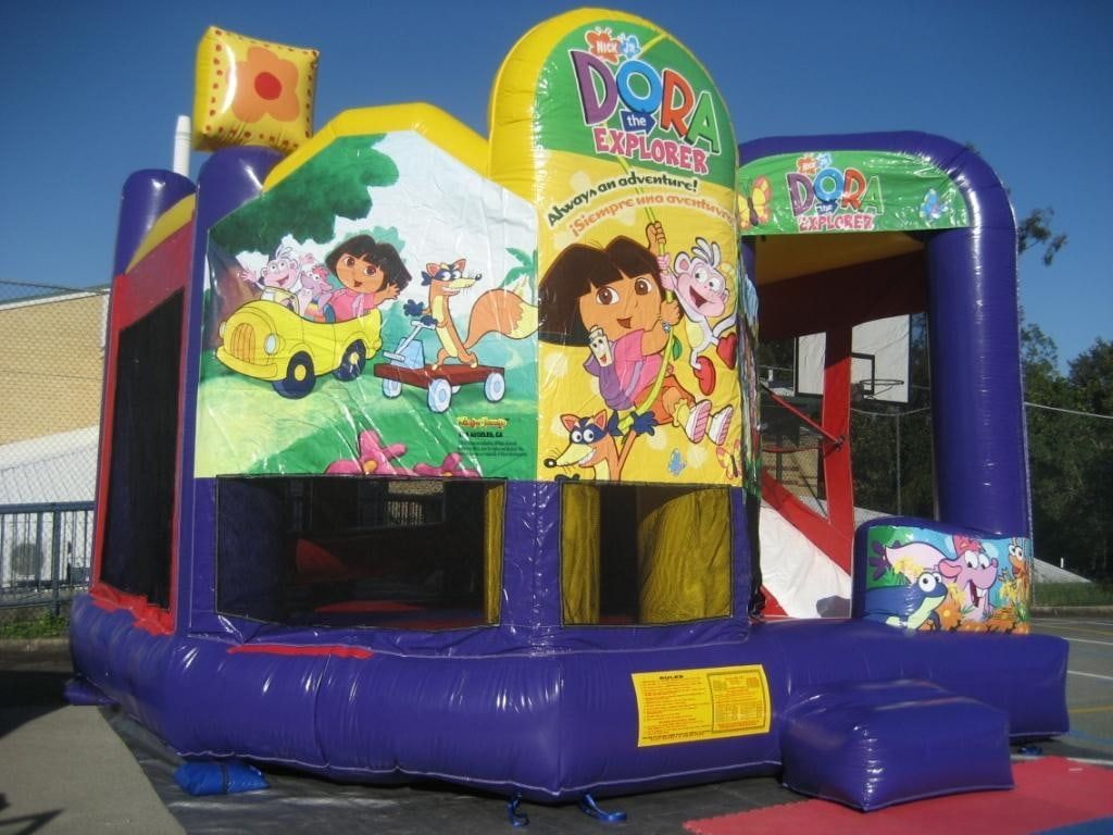 A Bouncy House With A Picture Of Dora The Explorer On It — Bills Amusements In Gladstone, QLD