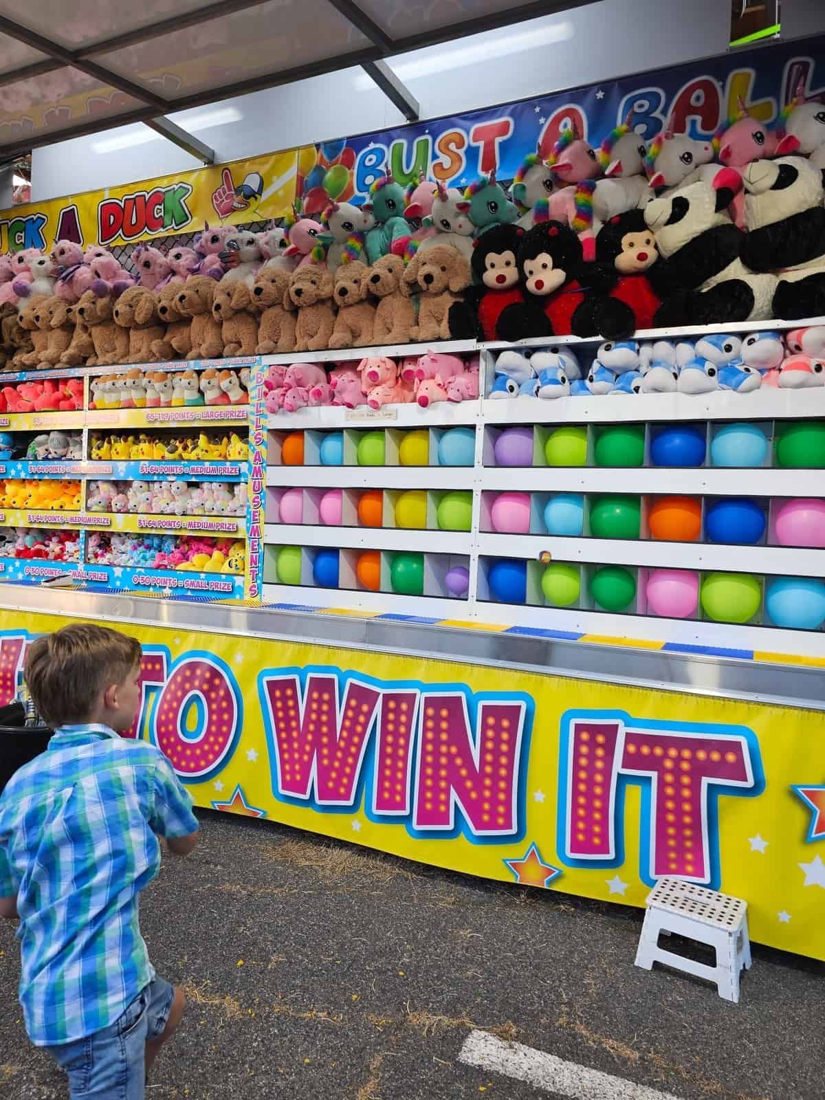 A Boy Is Playing A Game At A Carnival — Bills Amusements In Rockhampton, QLD