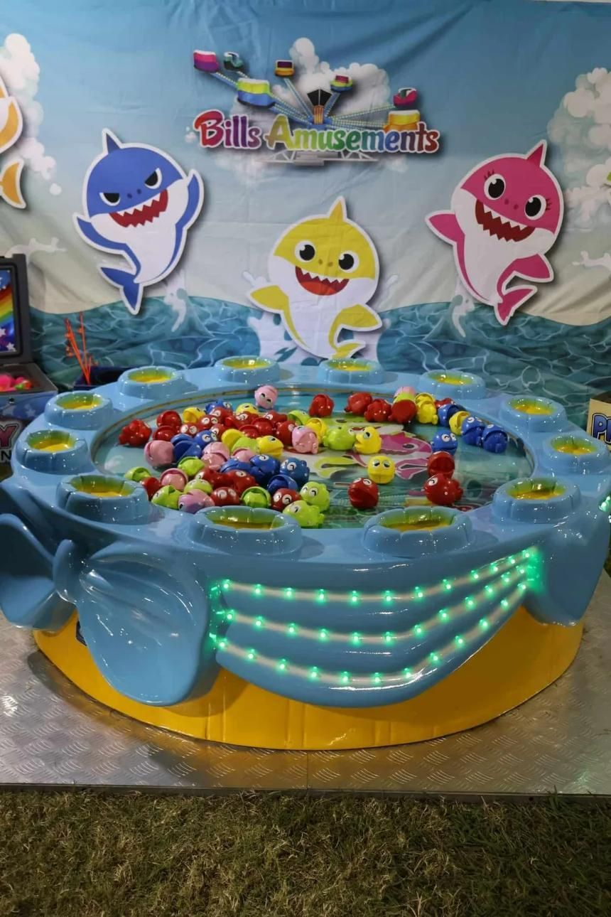 A Baby Shark Fishing Game Is Sitting On A Table — Bills Amusements In Bundaberg, QLD