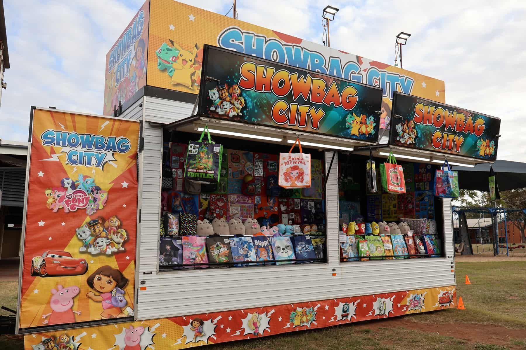 A Carnival Booth With A Lot Of Toys On It — Bills Amusements In Hervey Bay, QLD