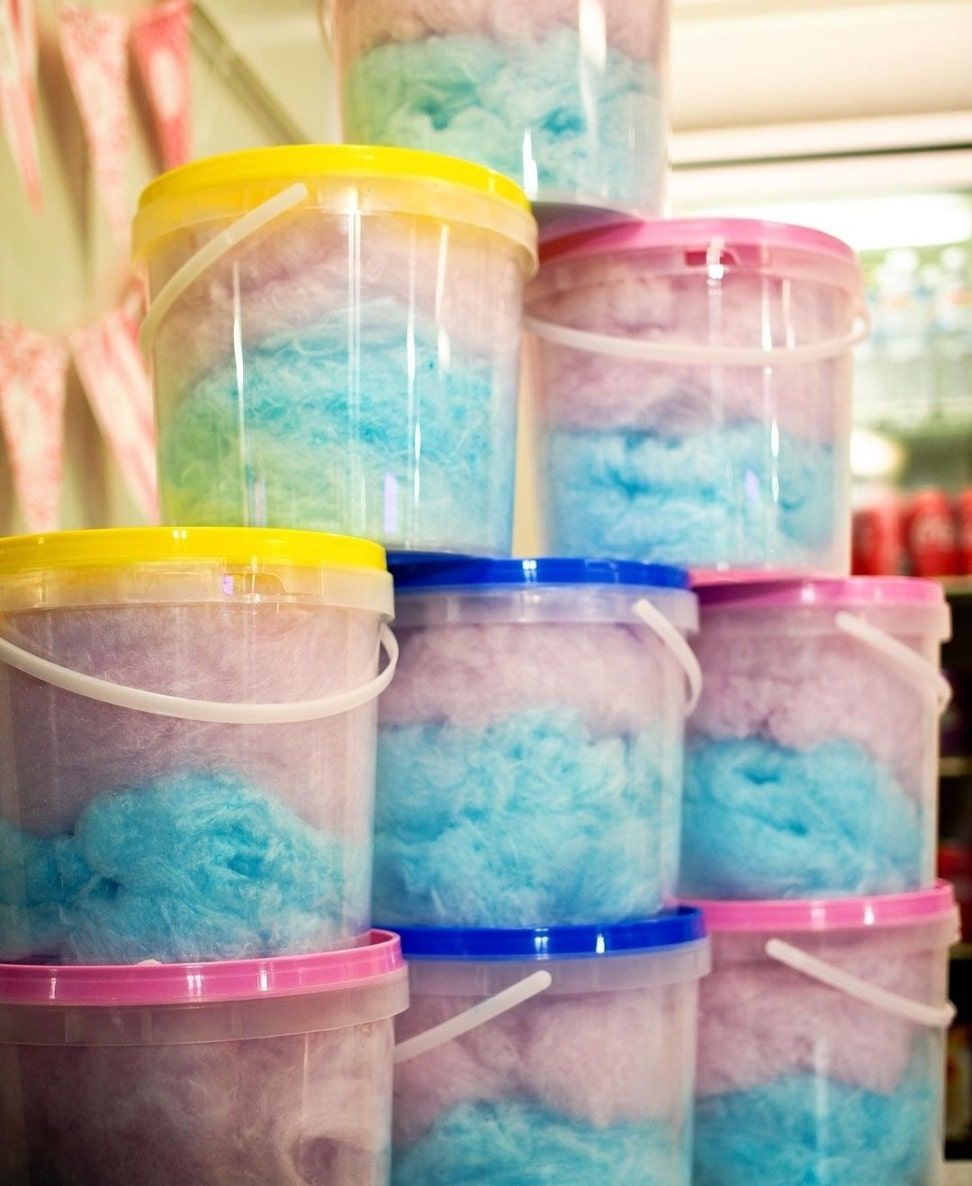 Buckets Of Cotton Candy Are Stacked On Top Of Each Other — Bills Amusements In Gladstone, QLD