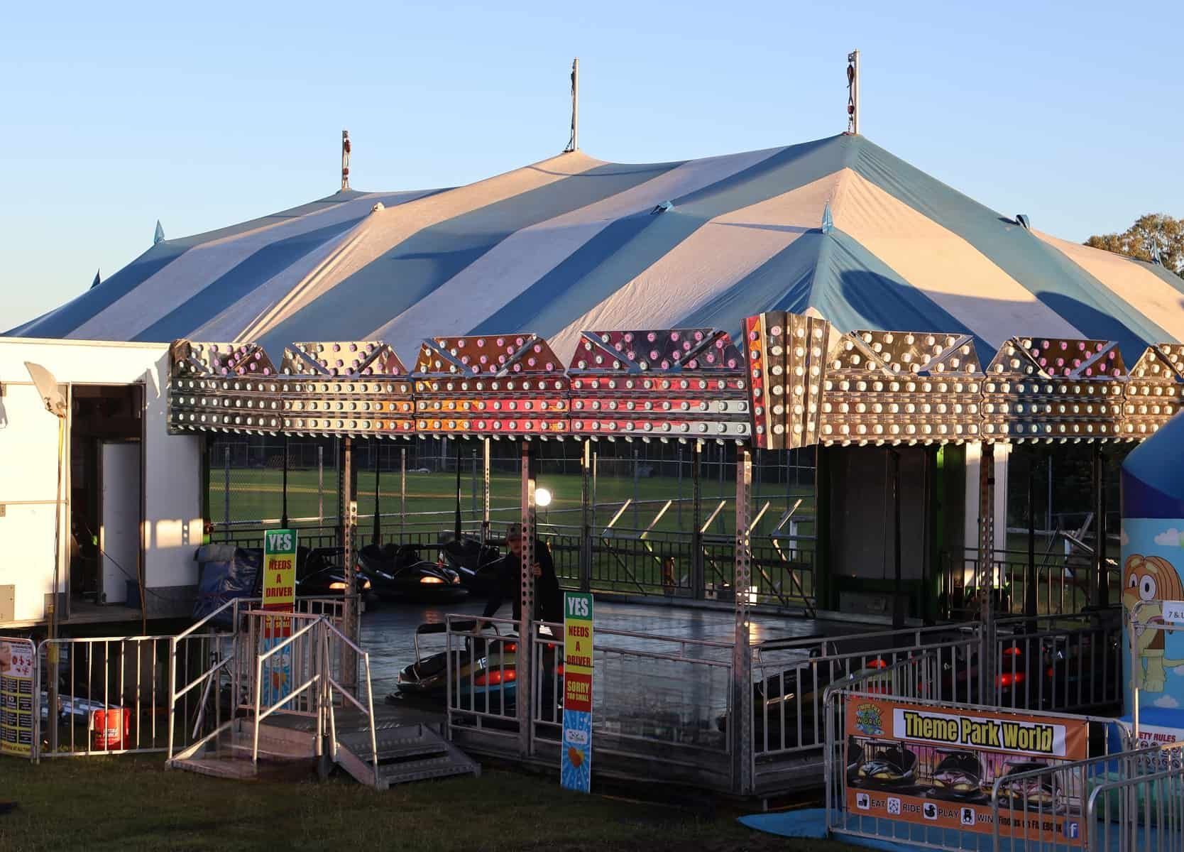 A Large Blue And White Tent With A Bouncy House In Front Of It — Bills Amusements In Mackay, QLD