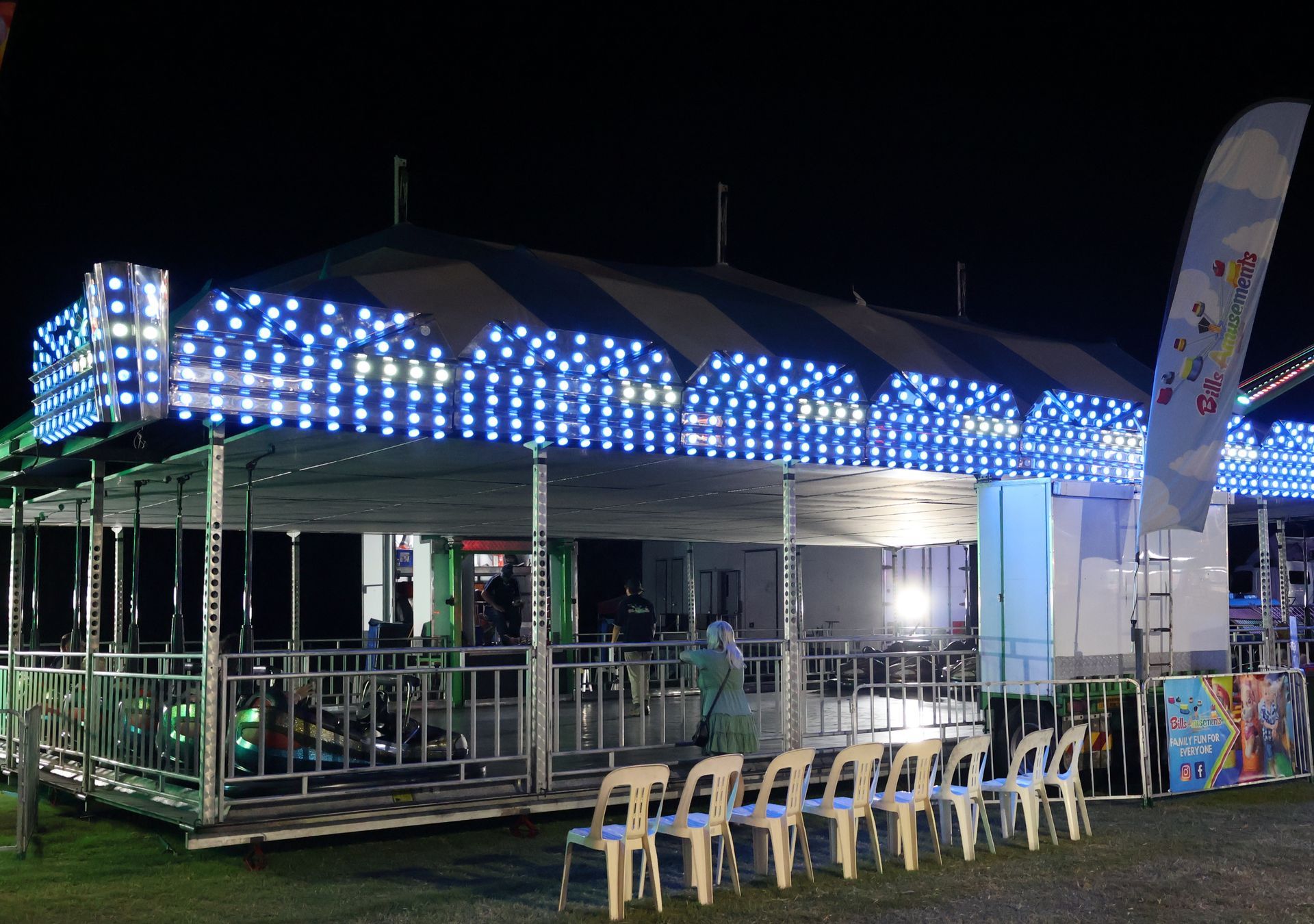 A Large Blue And White Tent With A Bouncy House In Front Of It — Bills Amusements In Rockhampton, QLD