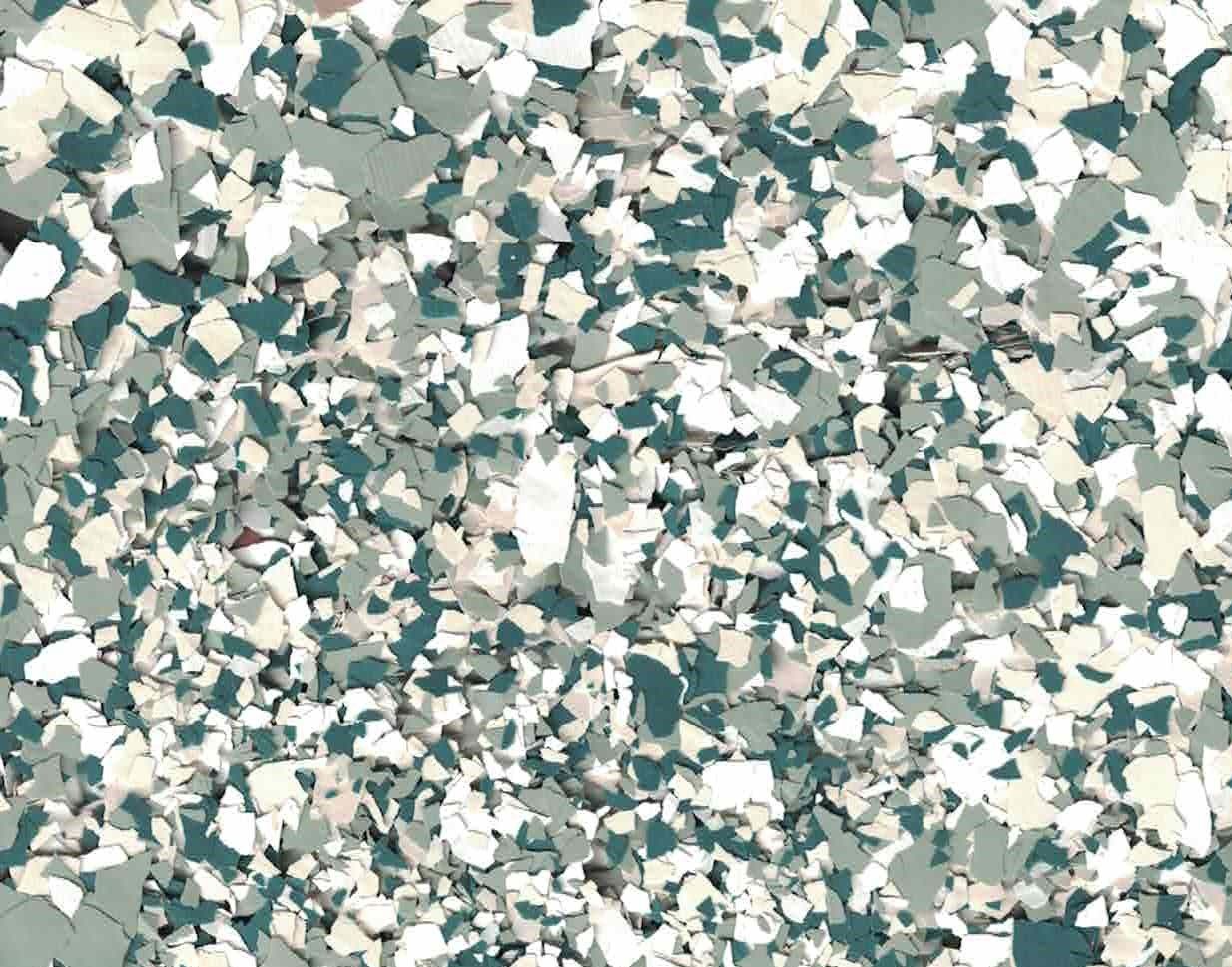 Abstract pattern of teal, gray, and white confetti-like shapes on a textured background