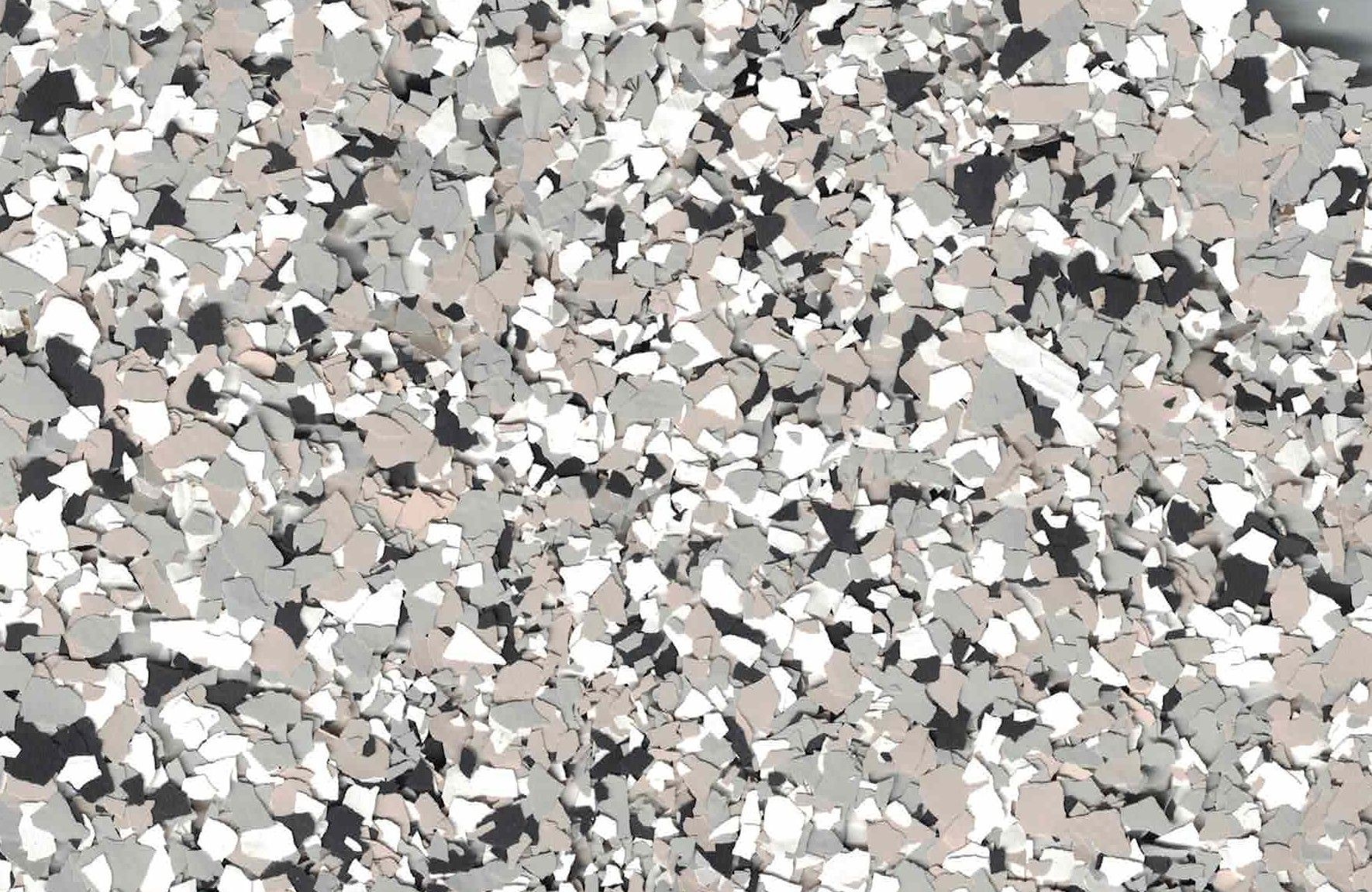 Abstract speckled gray, white, beige, and black pattern resembling terrazzo or confetti