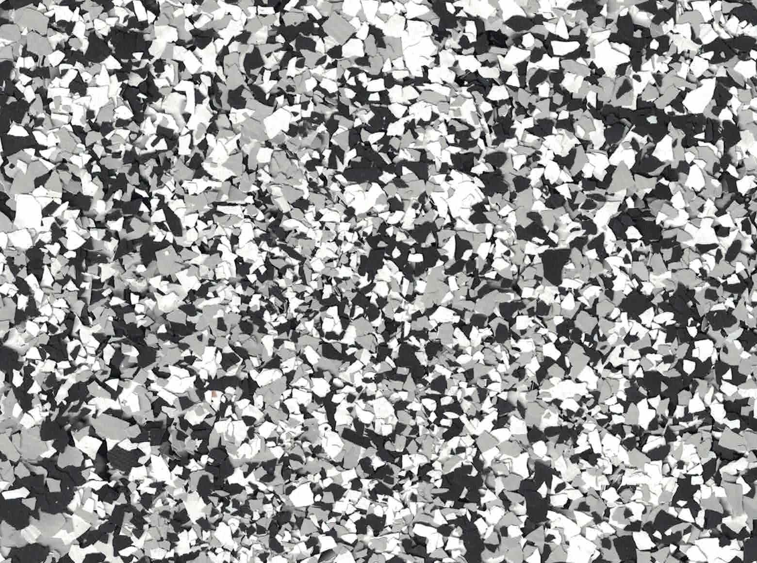 Black, white, and gray speckled abstract texture filling the frame