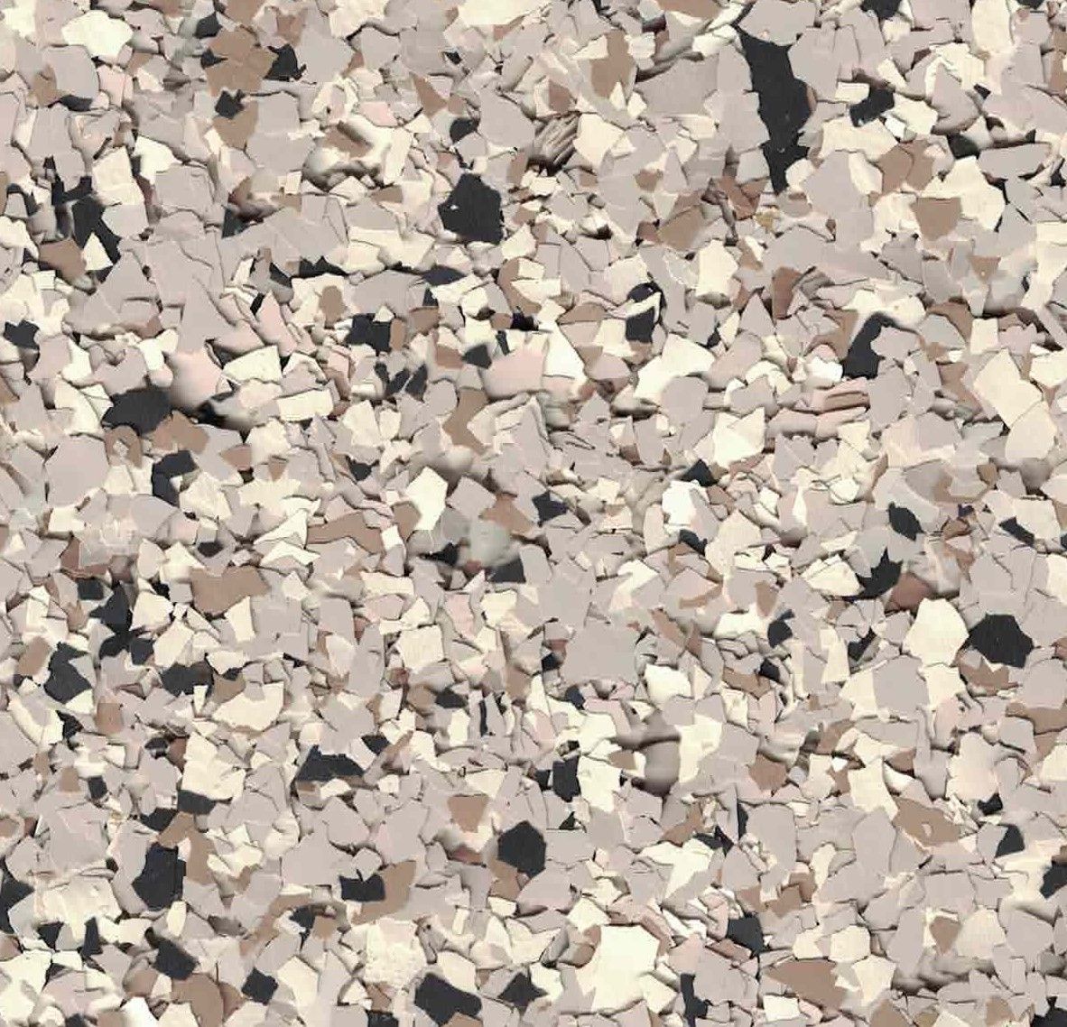 Close-up of beige, tan, and gray speckled gravel or terrazzo-like stone surface