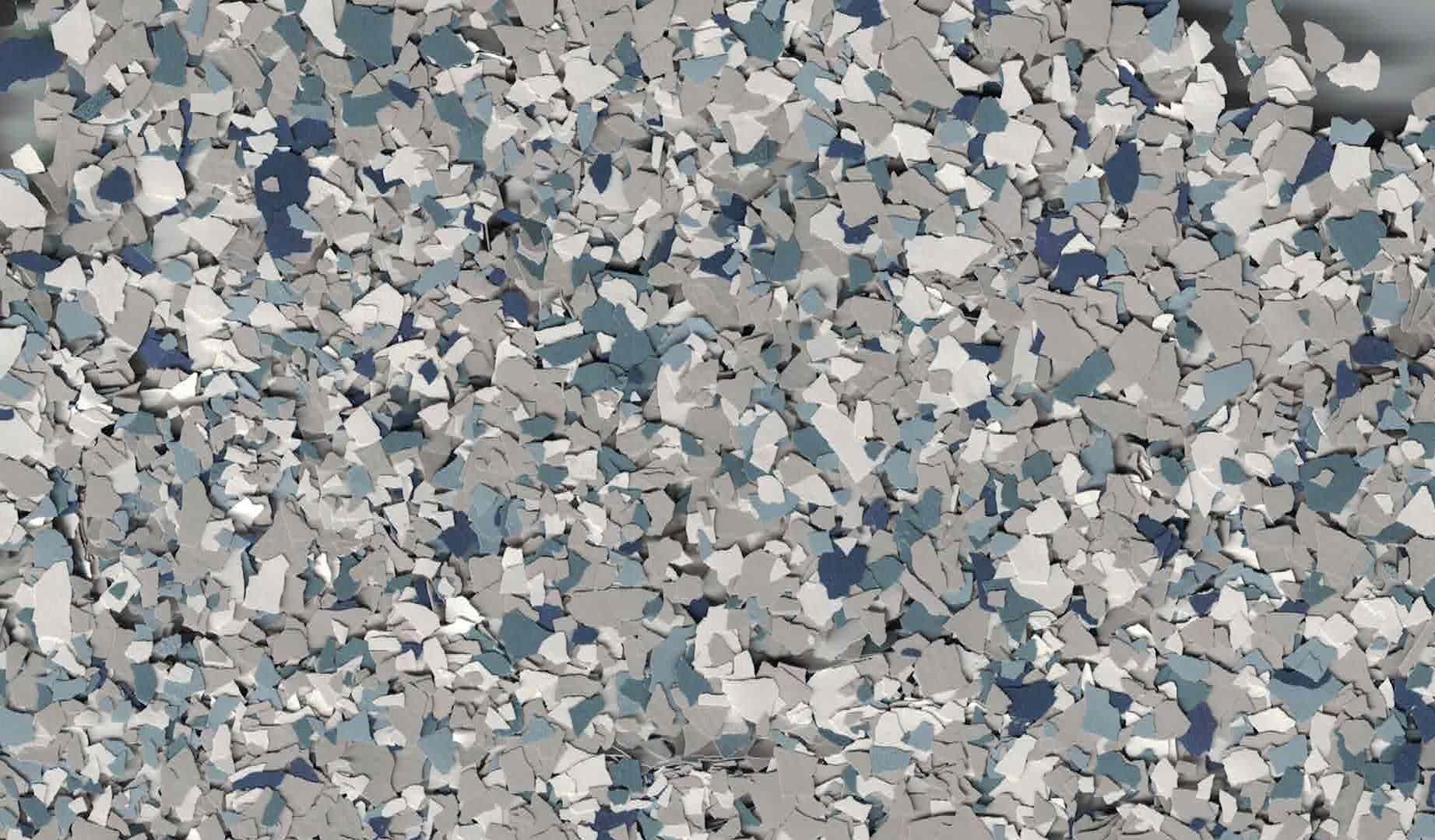 Close-up of a gray, white, and blue speckled stone or tile surface