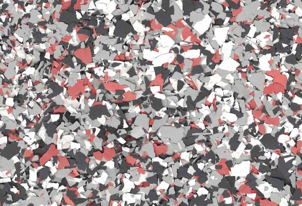 Abstract confetti-like pattern in red, white, gray, and black