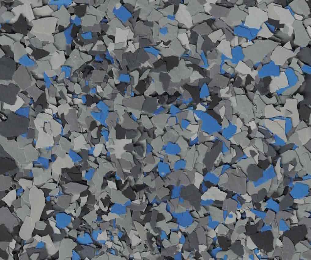 Abstract mosaic of gray, black, and blue geometric fragments scattered across the frame