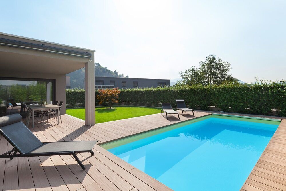Backyard With Pool, Patio, and Lounge Chairs — Creative Pools and Spas in Rosebud, VIC