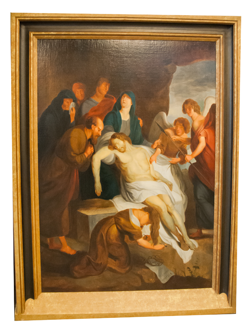 Statie 14: Jezus wordt in het graf gelegd.