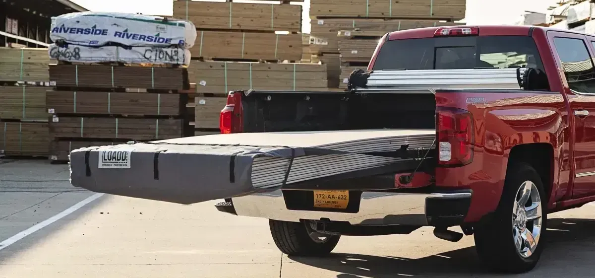 A Pick up truck delivering building materials