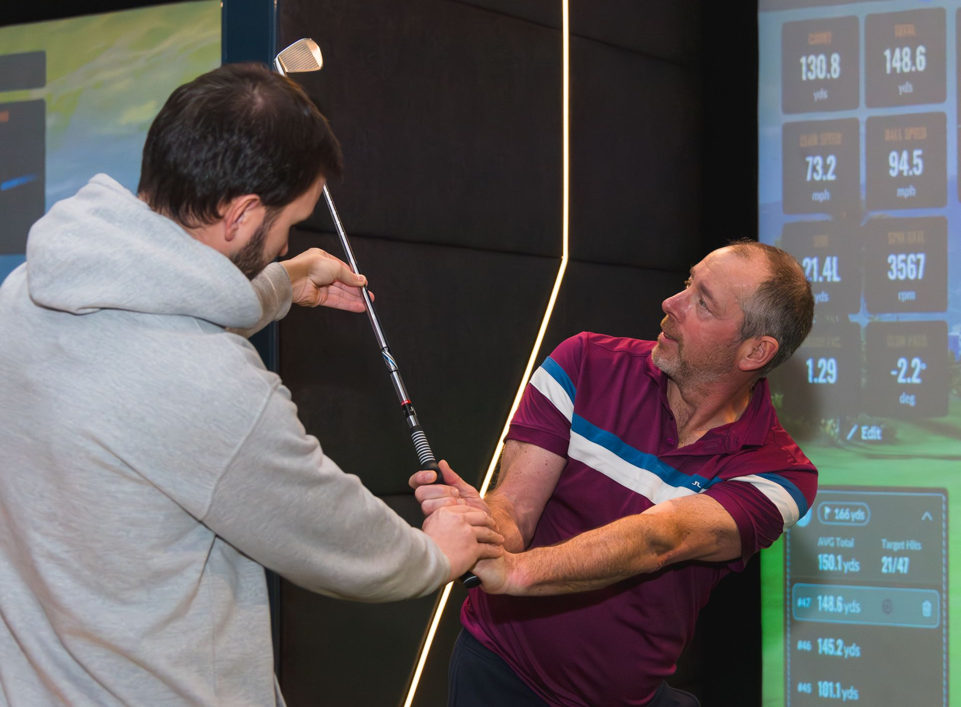 PGA professional coaches golf with a man at drive in golf Burntwood uk
