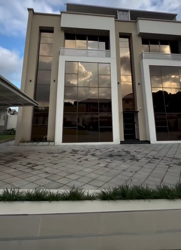 A large building with a lot of windows and reflections