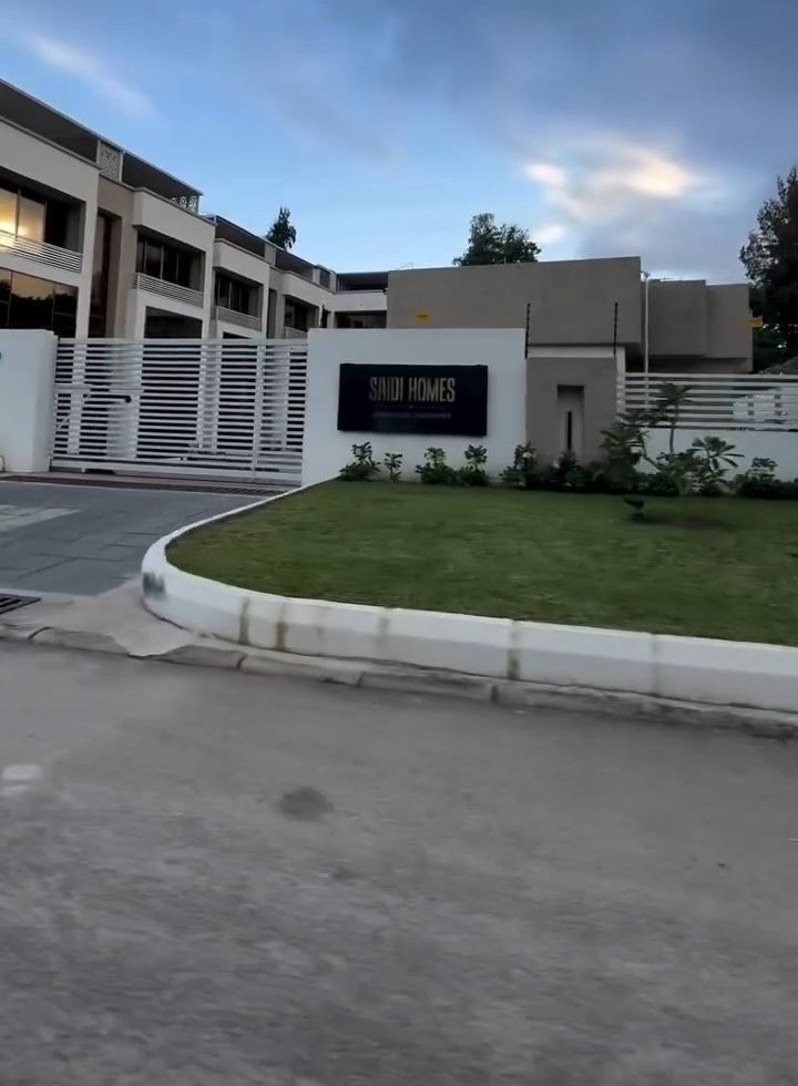 A building with a sign that says ' true homes ' on it