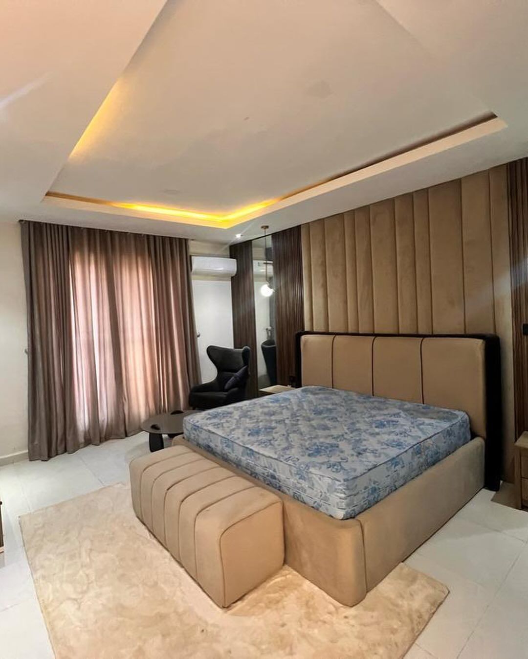 There is a large bed in the middle of the room.