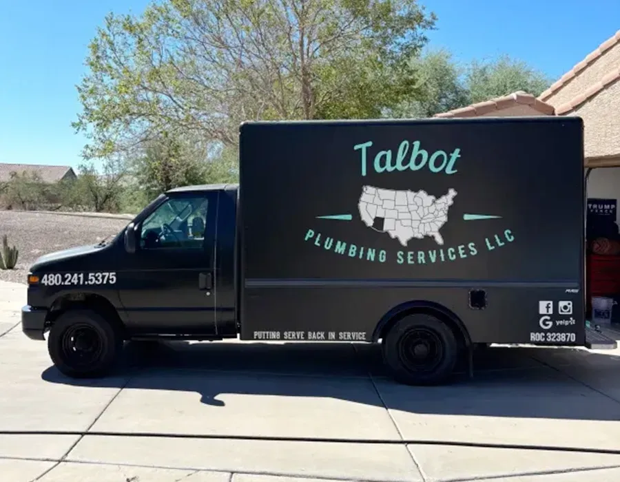 Black Talbot food truck parked on a sunny street under a blue sky