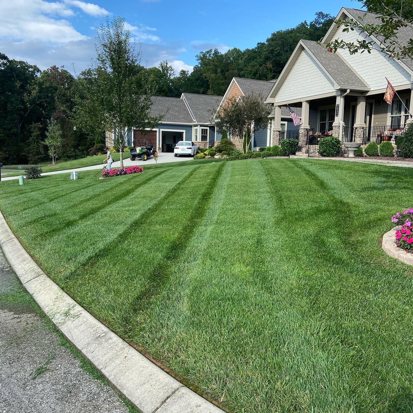 Lawn mowing and maintenance producing crisp mowing stripes