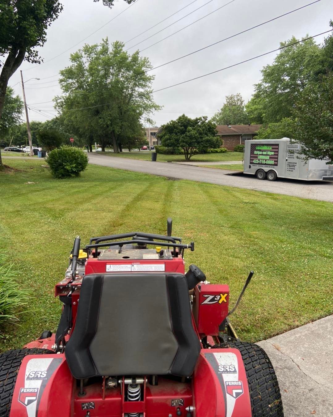 Expert lawn care service creating visible mowing stripes