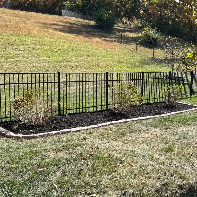 New mulch bed installed along fence line
