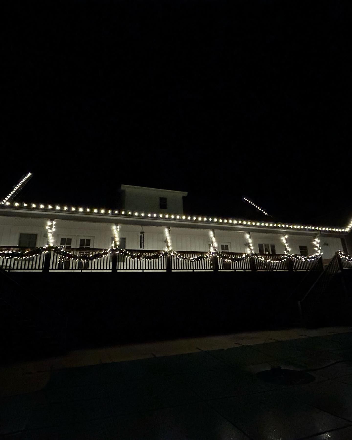 White Christmas lights outlining home exterior