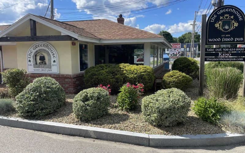 A small building with signs: 