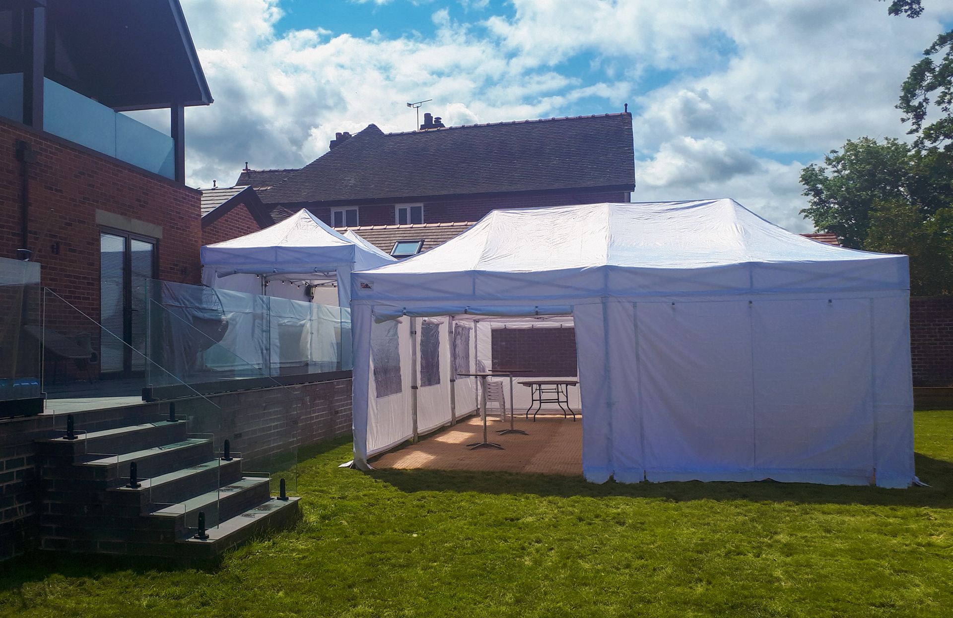 white marquee on decking