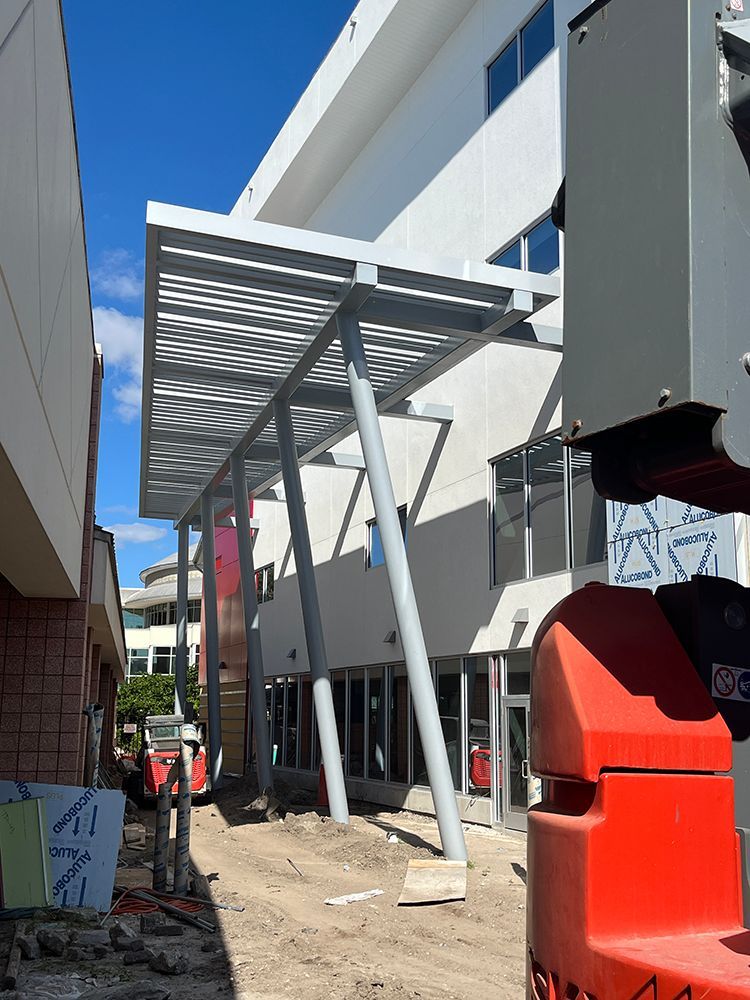 newly added awning on a building under construction