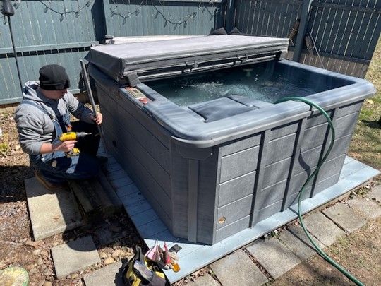 Handyman repairing a hot tub - Hot Tub Repair in Lebanon, Pa