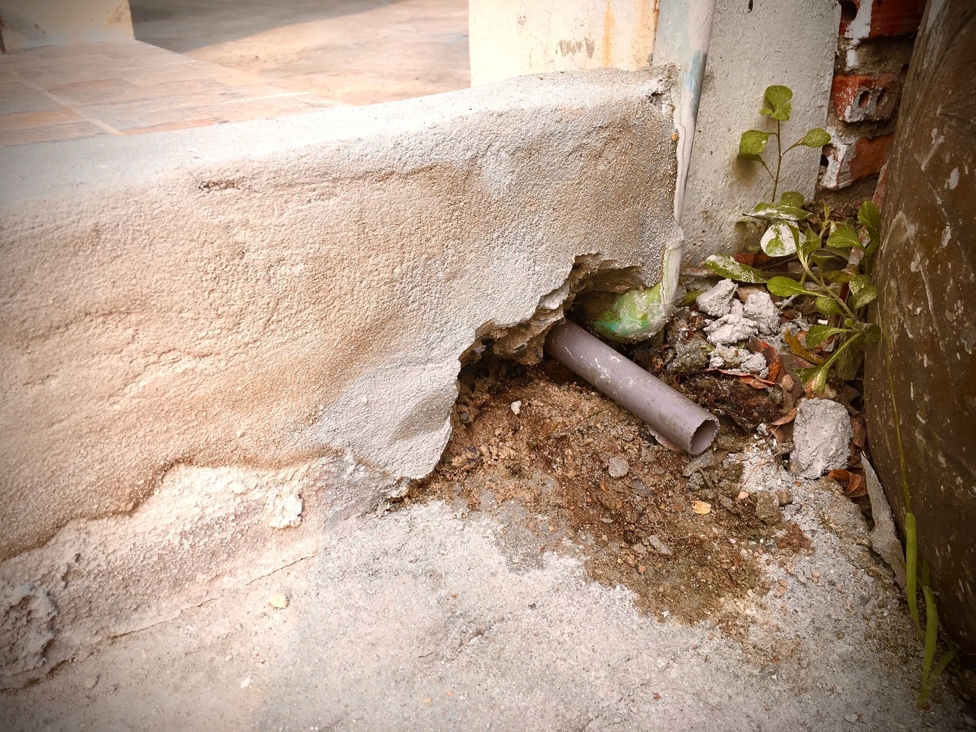 Air conditioner condensate drain pipe showing moisture buildup during a humid Corpus Christi summer.