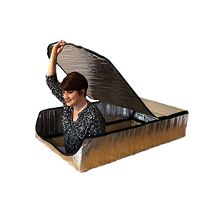Woman lifting lid on a large cardboard box costume against a white background