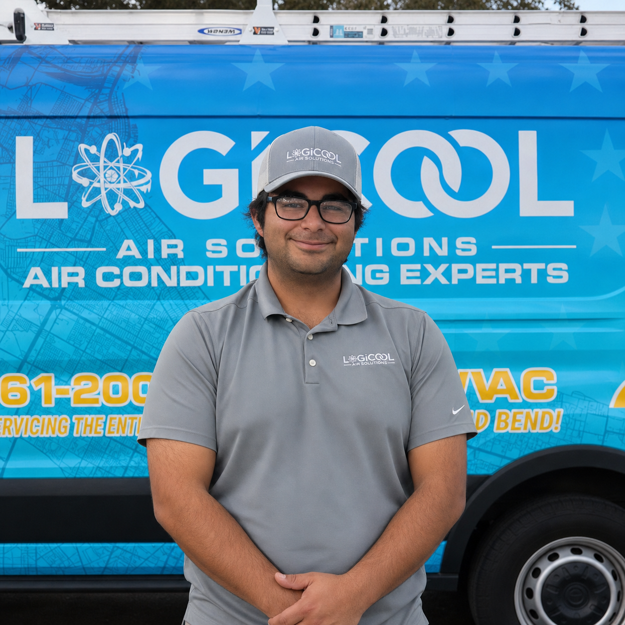 Smiling person in gray shirt standing before a blue GICCO air solutions truck wrap.