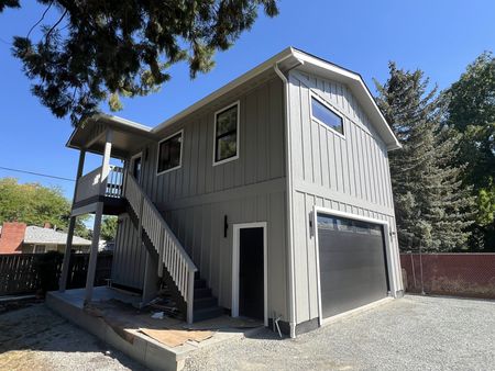 A two story house with new exterior paint and trim in Southern Oregon.