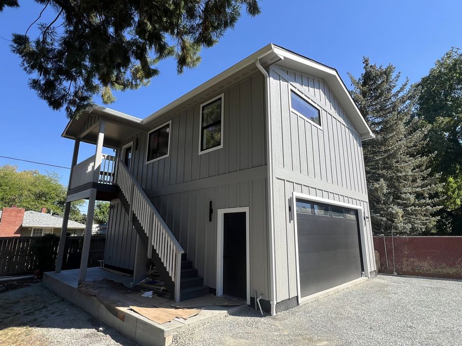 A two story house with new exterior paint and trim in Southern Oregon.