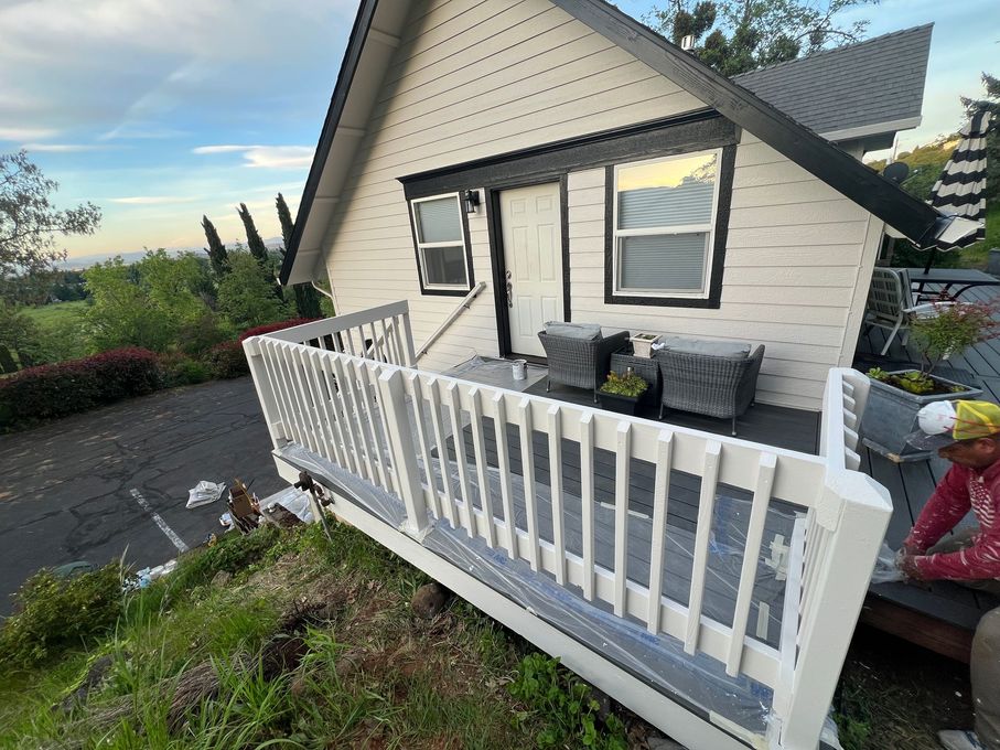 A house in Jacksonville, Oregon has new paint on the deck railing.