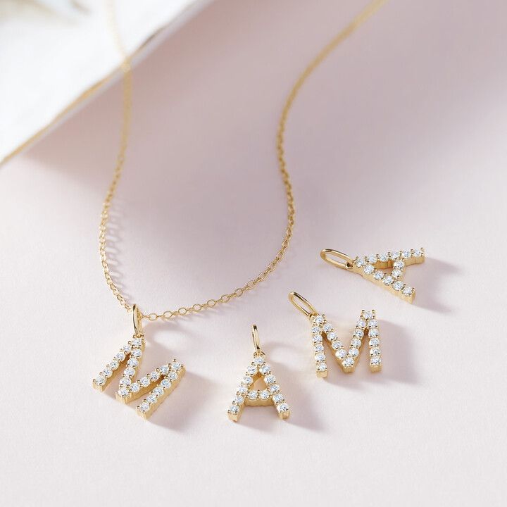 A necklace with the letter a and m on it