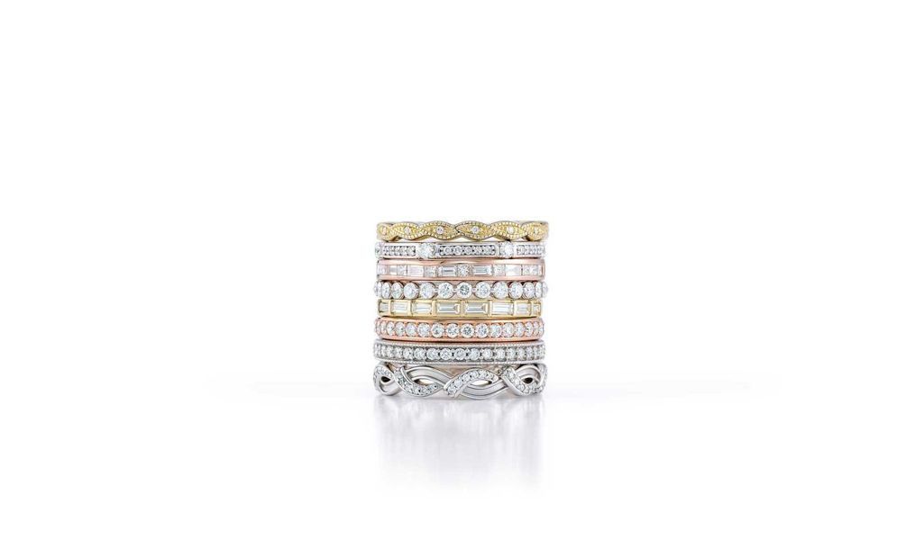 A stack of rings sitting on top of each other on a white surface.