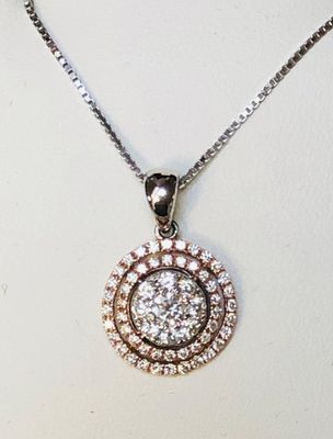 A necklace with a round pendant on a chain