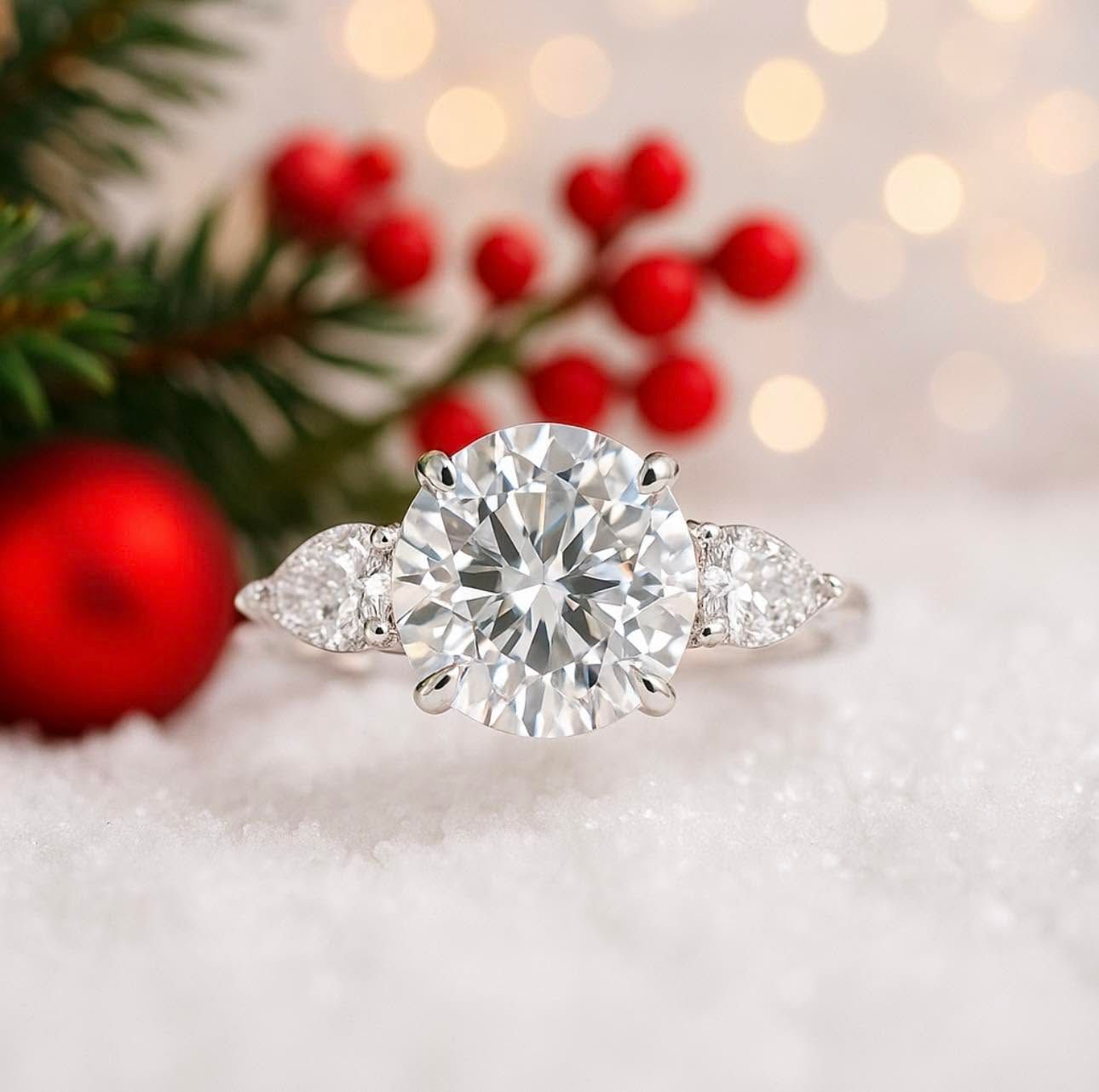 Diamond ring on white fur with festive red berries and blurred holiday lights in the background