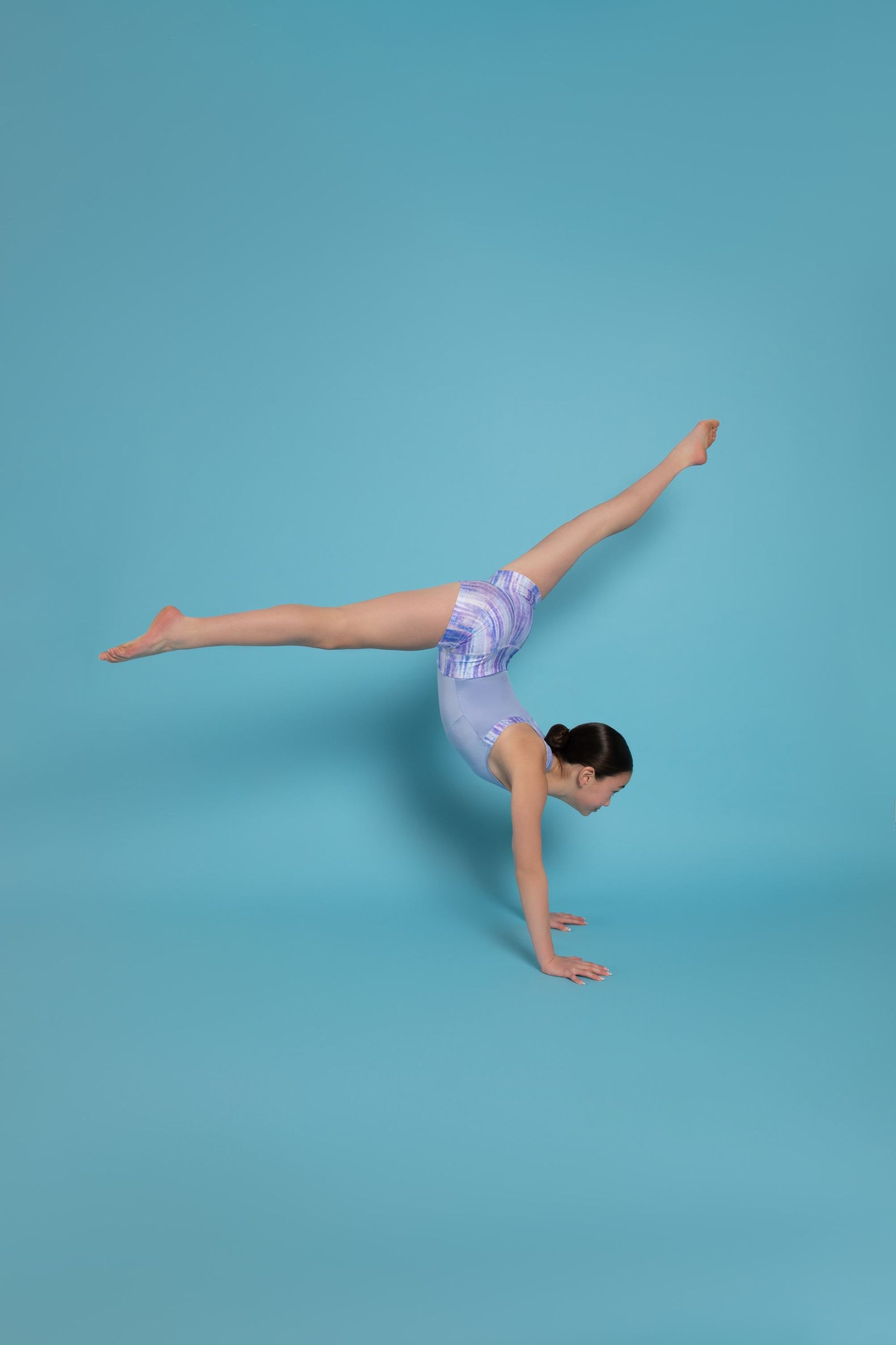 A Young Girl Is Doing A Handstand On A Blue Background — Dance Jam In Burnside, QLD