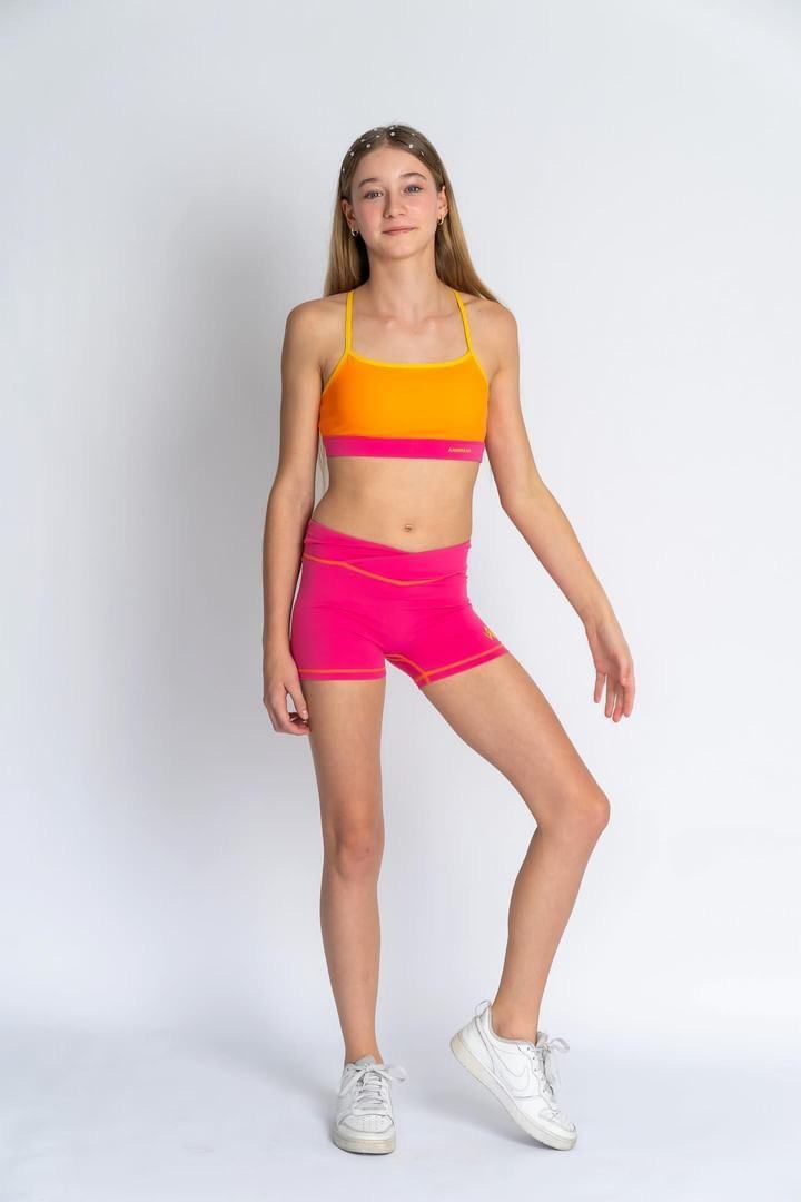 A Young Girl Is Wearing A Crop Top And Pink Shorts — Dance Jam In Burnside, QLD
