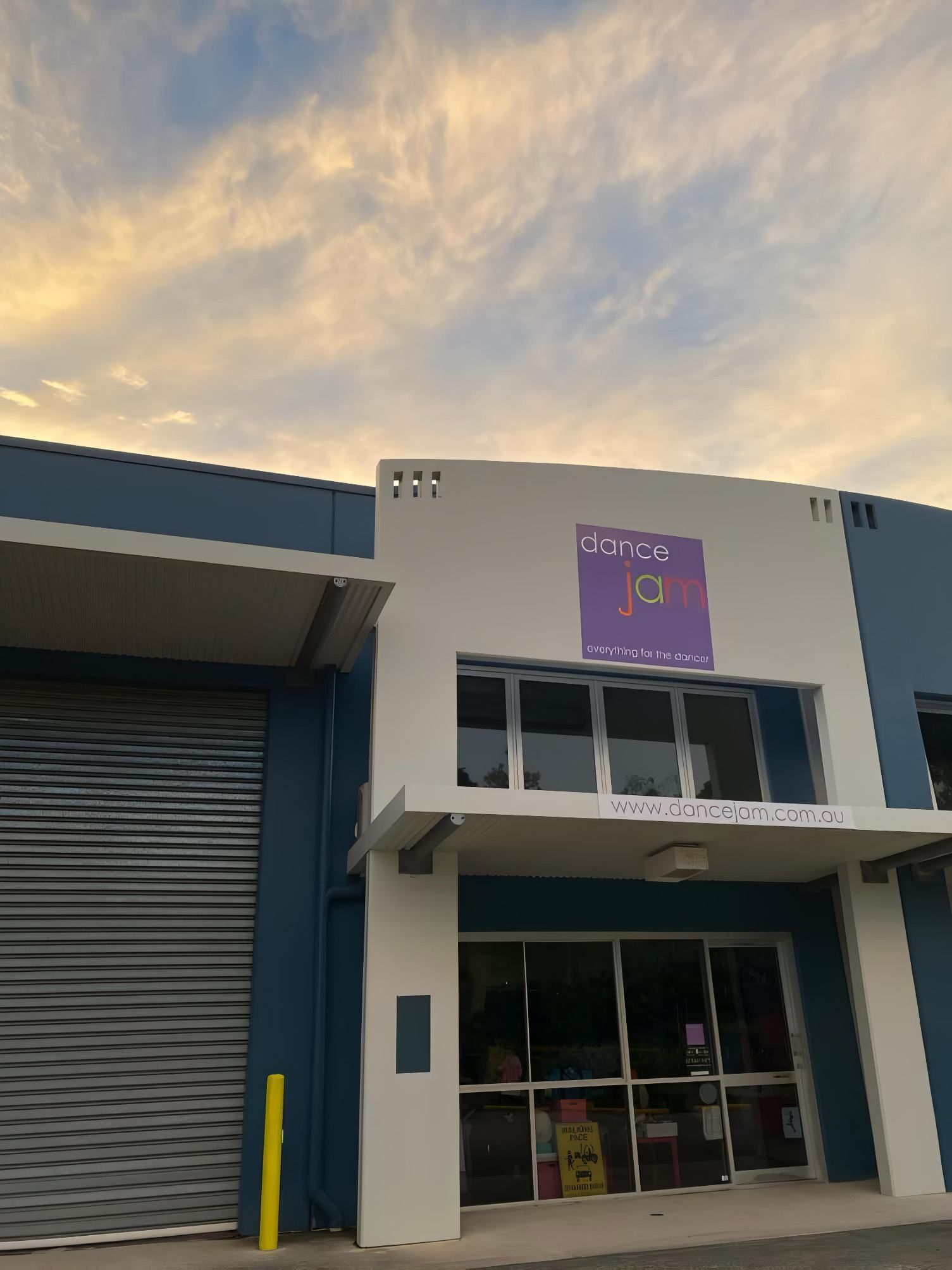 A Blue And White Building With A Purple Sign On It — Dance Jam In Burnside, QLD